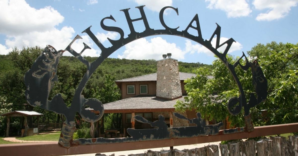 metal sign above fish camps entrance